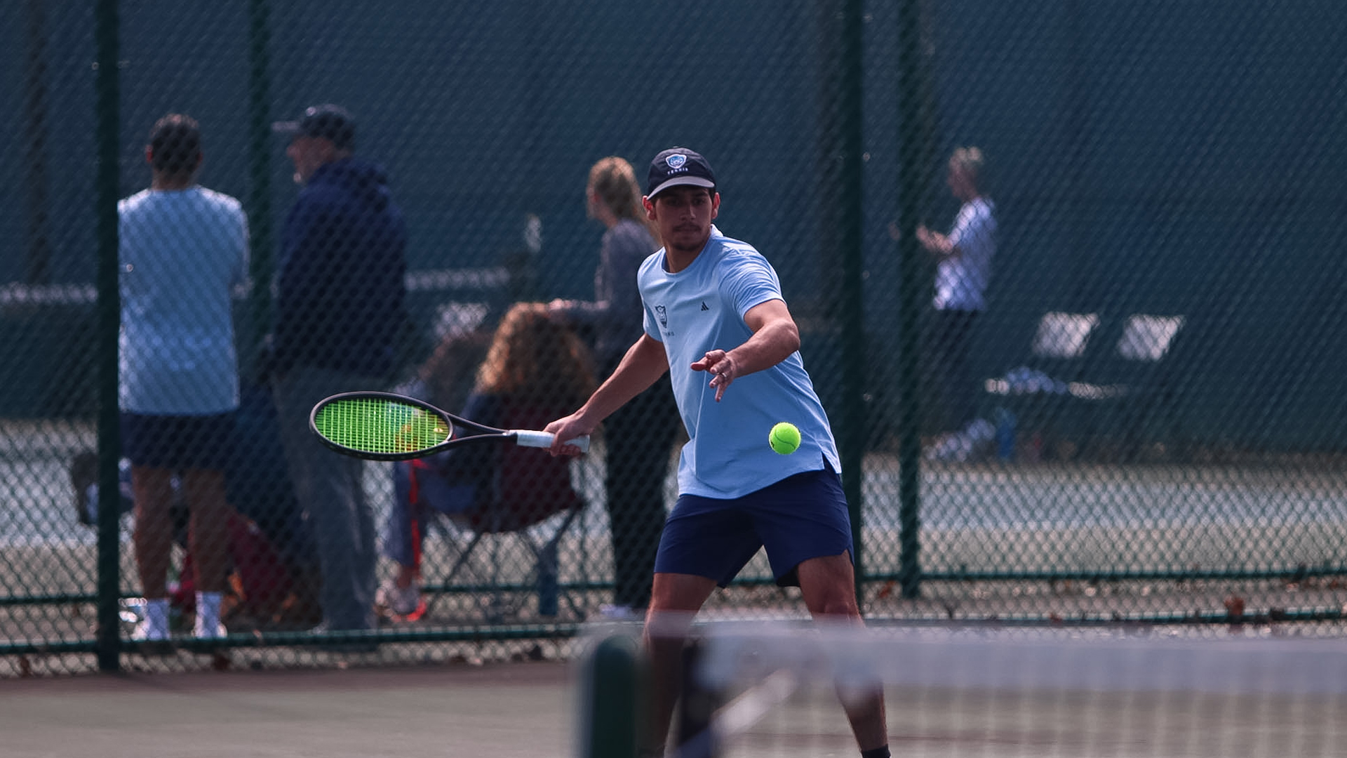 Almovodar hitting a tennis ball in a match