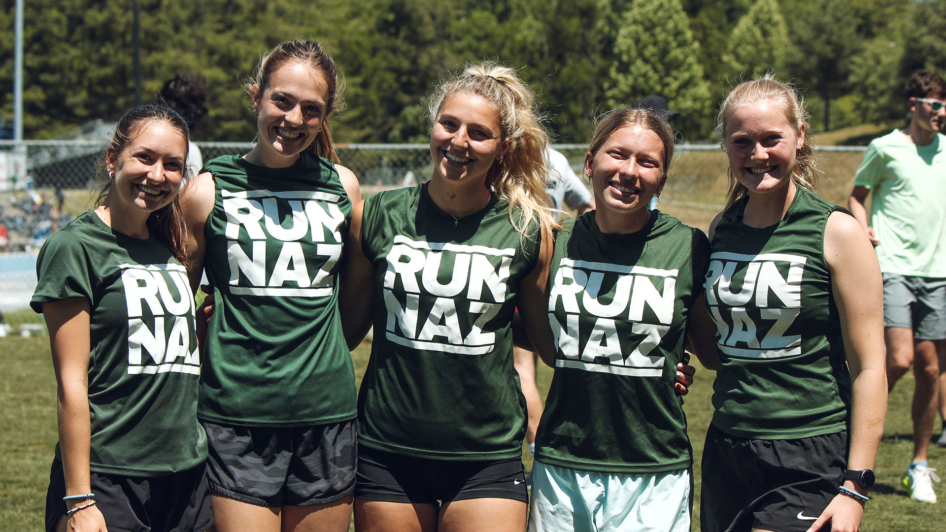 The women's 4x8 standing for a picture
