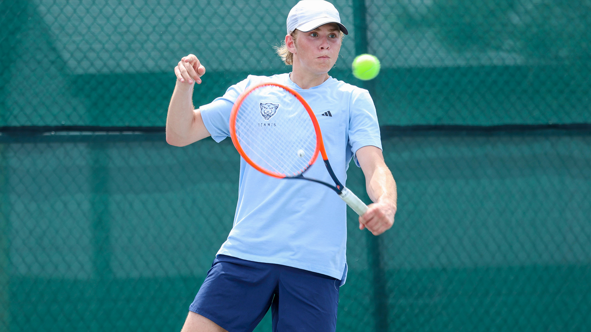 Fitzpatrick hits the tennis ball in his match at Huntington