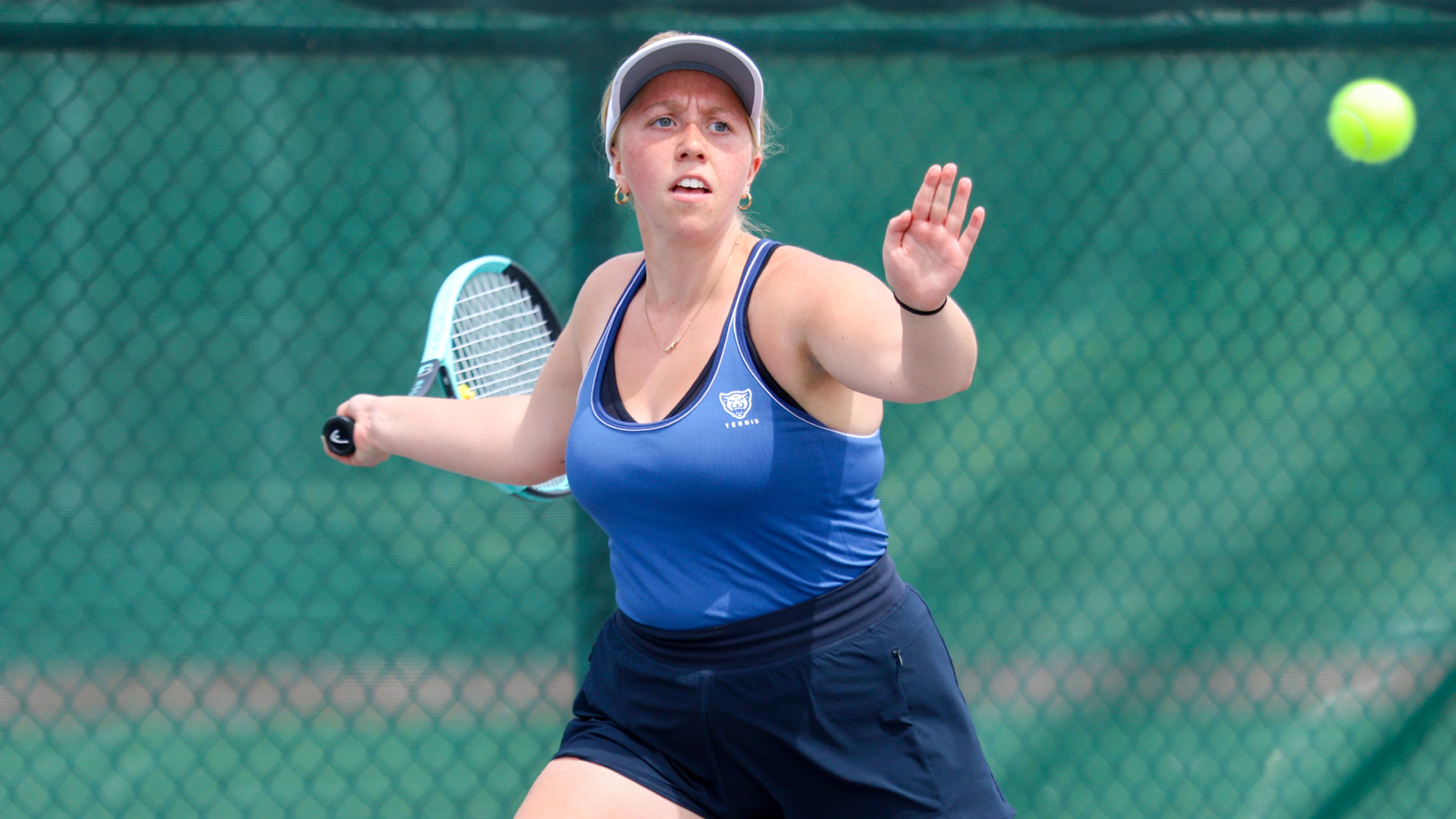 Mahek hits a tennis ball against Huntington