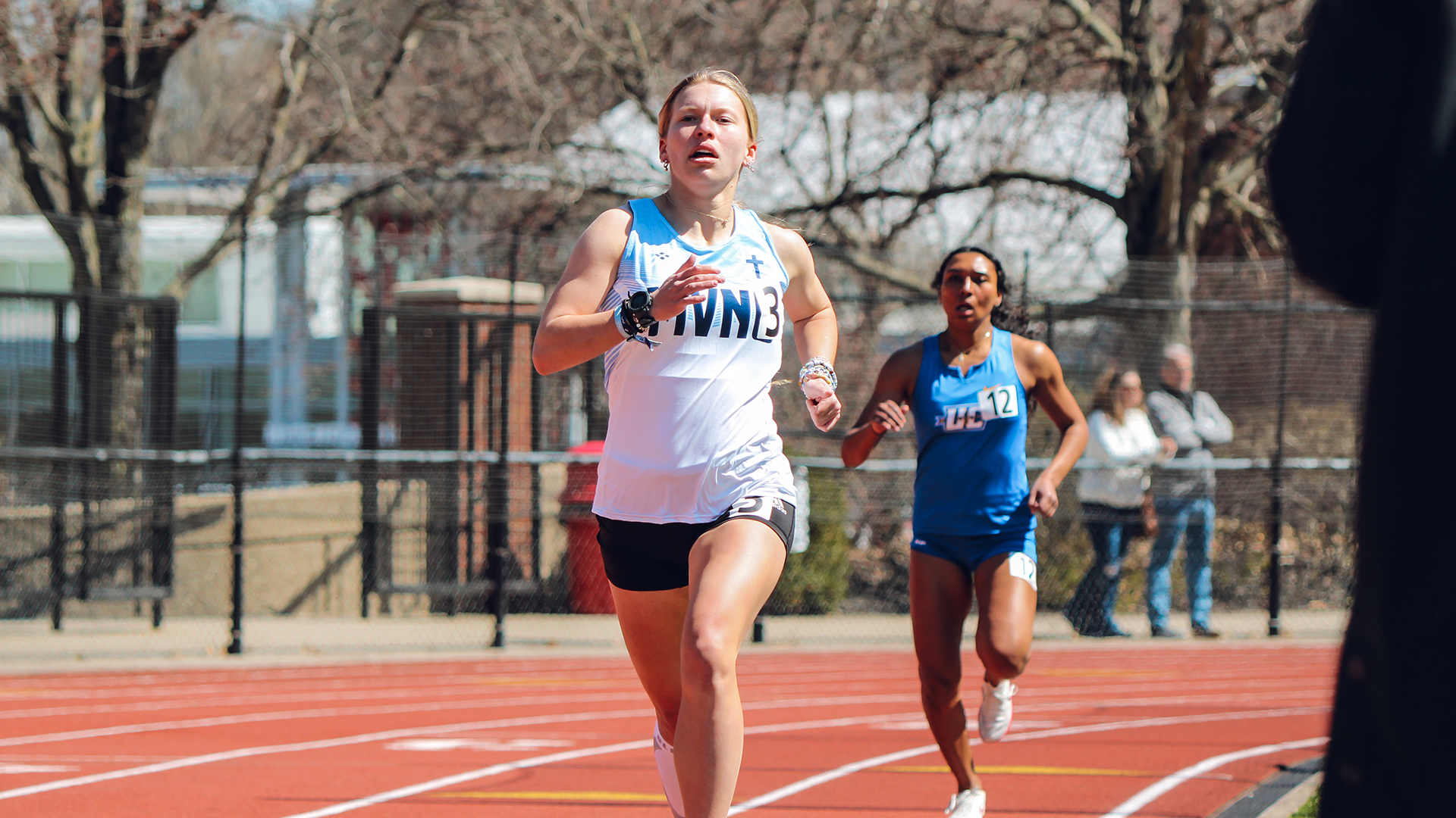Lauren Warder running on the track for MVNU